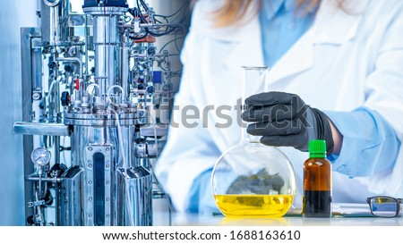 Microbiological laboratory. Bioreactor. Cultivation of microorganisms in the bioreactor. Laboratory fermenter. Microbial fermentation. The creation of drugs. Microbiology. Biotech industry. 