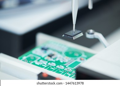 Microchip Semiconductor Manufacturing. Automatic Machine Robot Installing Chip On Board.