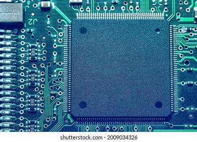 Microchips integrated on the board. The microcircuit photographed in close-up.