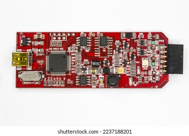A Microcontroller programmer and debugger red PCB USB mini connection and six way female header