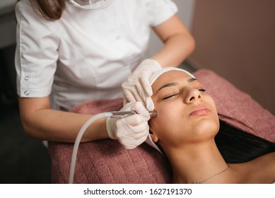 Microdermabrasion peeling treatment in a beauty spa salon. Cosmetology and skin care concept