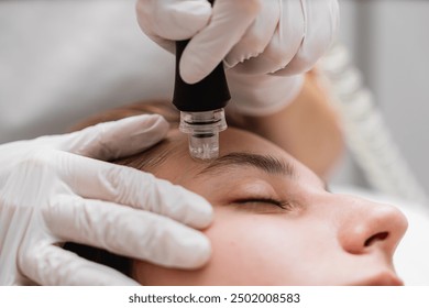 Microdermabrasion treatment session at a skincare clinic for facial rejuvenation - Powered by Shutterstock