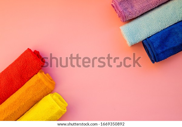 Microfiber cloth for housework or car\
cleaning.Cleaning towels microfiber cloth isolated against white\
background, Folded cleaning textile napkins colorful stack.\
Domestic household\
cleaning.Copy