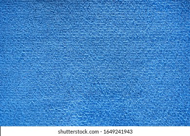 Microfiber towel blue terry texture swatch. Micro fiber material cloth with close up shot. Fabric texture background. Fabric blue pattern. Cleaning service. Macro object.