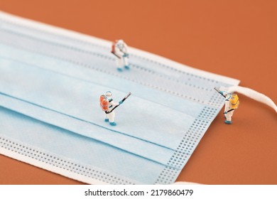 Microfilm medical disinfection personnel and masks - Shutterstock ID 2179860479