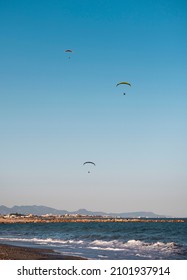 microlights flying over the sea