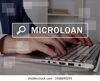  MICROLOAN Text In Search Bar. Loan Officer Looking For Something At Laptop. MICROLOAN Concept. 
