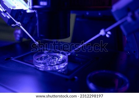Micromanipulator catching spermatozoa to make injection into oocyte