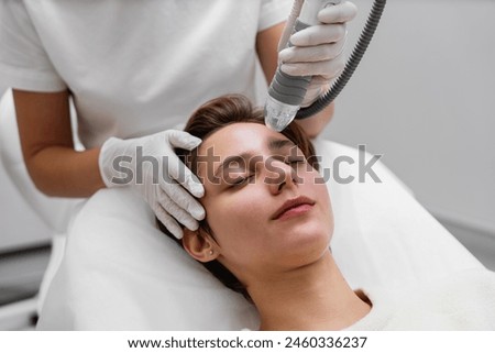 Microneedle RF lifting procedure. Hardware cosmetology. High quality photo