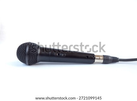 Microphone with a cable connected on white background