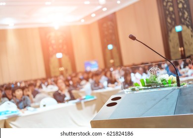 Microphone Close Up Shot In Seminar Or Meeting Room With People In Blur Focus For Copy Space