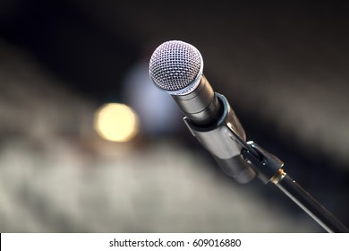 Microphone close-up on stage.
microphone on the stage and empty hall during the rehearsal