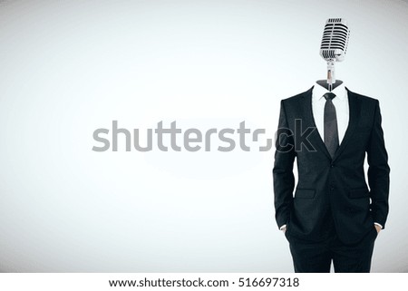 Microphone headed businessman on light background with copy space. Speech concept