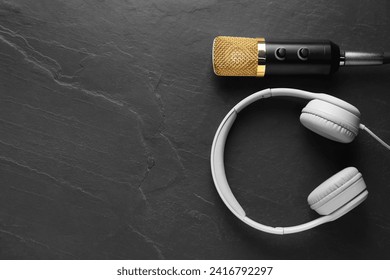 Microphone and headphones on grey textured background, flat lay with space for text. Sound recording and reinforcement - Powered by Shutterstock