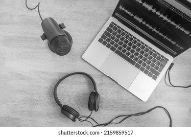 Microphone, Headphones And Wave Form On Laptop Screen