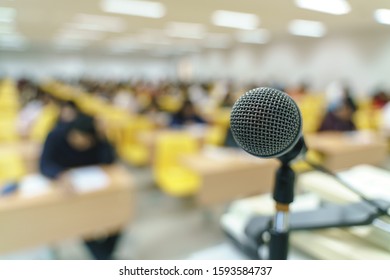 Microphone at lecture room or study classroom with Asian students taking an exam