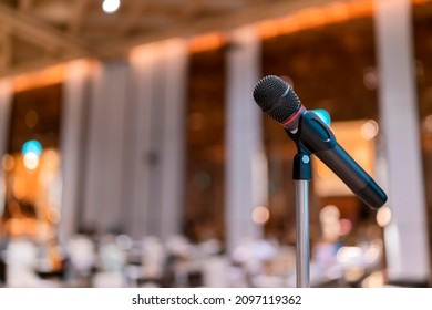 Microphone In Meeting Room For A Conference.Public Speaking Backgrounds, Close-up The Microphone On Stand For Speaker Speech Presentation Stage Performance 