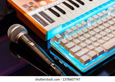 microphone, midi keyboard controller and computer keyboard. home recording studio concept