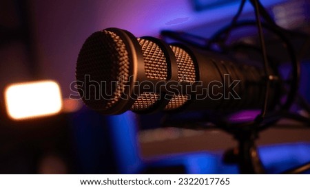Microphone, mounted on desktop boom arm.
