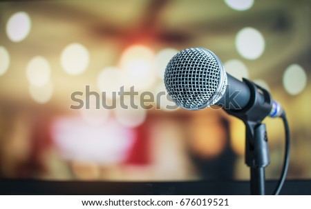Microphone on abstract blurred of speech in seminar room or speaking conference hall light, Event Background