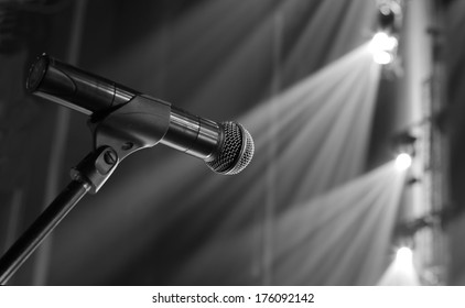 Microphone On The Stage And Empty Hall During The Rehearsal Black And White Photo