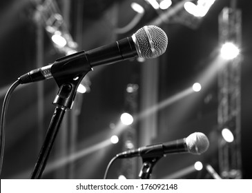 Microphone On The Stage And Empty Hall During The Rehearsal Black And White Photo