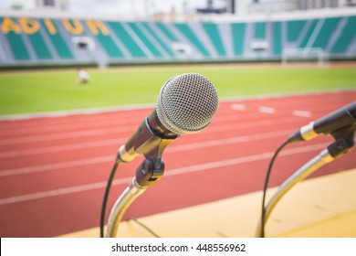 Microphone On Table Side Sport Field In Stadium For Commentator.