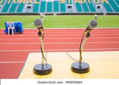 Microphone On Table Side Sport Field In Stadium For Commentator.