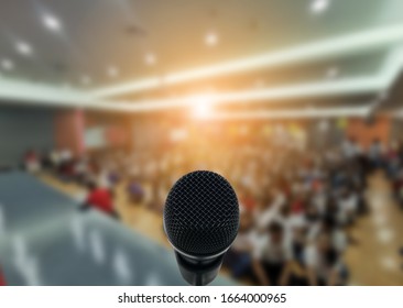 Microphone Over The Abstract Blurred Photo Of Conference Hall Or Seminar Room With Attendee Background,Small Business Training Concept,Public Speaking