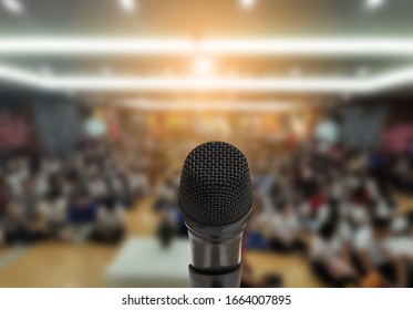 Microphone Over The Abstract Blurred Photo Of Conference Hall Or Seminar Room With Attendee Background,Small Business Training Concept,Public Speaking