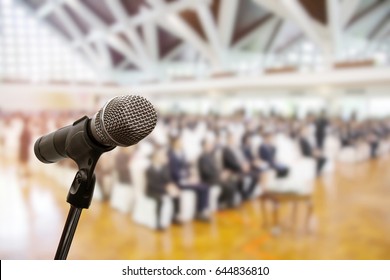 Microphone Over The Blurred Business Conference Hall Or Seminar Room, Blurred Background