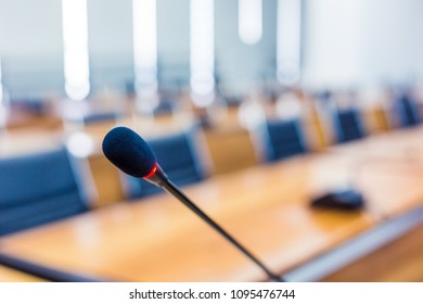 Microphone over the blurred business forum Meeting or Conference Training Learning Coaching Room Concept, Blurred background