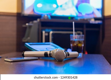 Microphone And Remote Control In Karaoke Box