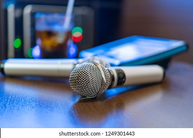 Microphone And Remote Control In Karaoke Box