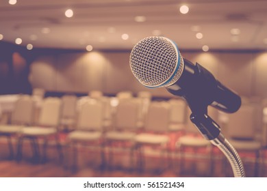 Microphone in seminar event defocus on meeting room background , process in vintage style