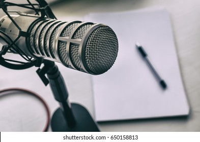 Microphone, sheets of paper and pen - Shutterstock ID 650158813