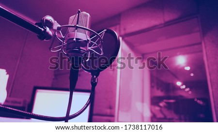 Microphone and shock mount and pop filter on tripod which use in sound production recording studio for vocalist or narrator or dj on brodcasting or professional creator live online channel 