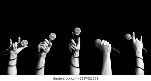 microphone in singer hand in various poses. black and white. singing and performer concept - Powered by Shutterstock