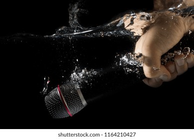 Microphone Sinking - Underwater Mic. Holding A Microphone In Hand Under Water.