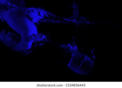 Microphone Sinking - Underwater Mic. Holding A Microphone In Hand Under Water.