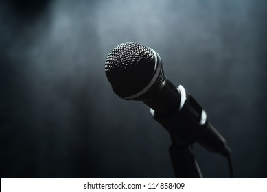 Microphone in a smoke on a dark background