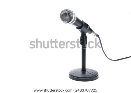 Similar – Image, Stock Photo Microphone on stand on stage close up with searchlight light. Professional mic at concert hall or conference room, karaoke, night club, bar. Public events, festival, wedding. Copy space.