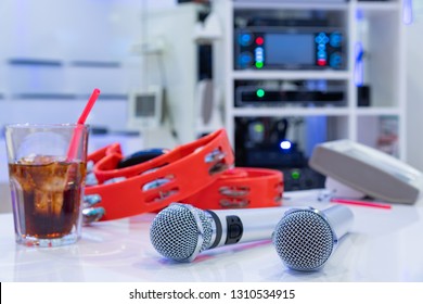 Microphone And Tambourine In Karaoke Box