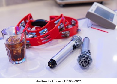 Microphone And Tambourine In Karaoke Box