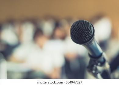 Microphone voice speaker with audiences or students in seminar classroom, lecture hall or conference meeting in educational business event for host, teacher, or coaching mentor 