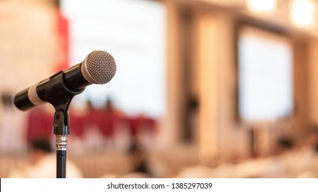 Microphone voice speaker in business seminar, speech presentation, town hall meeting, lecture hall or conference room in corporate or community event for host or public hearing - Shutterstock ID 1385297039