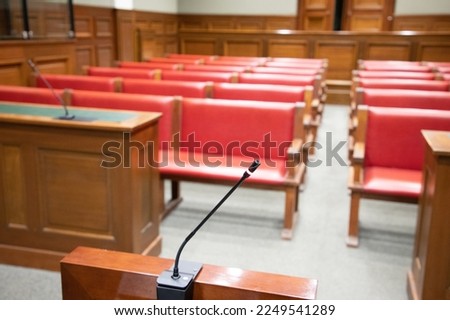 microphone of witnesses inside the courtroom in the court of justice with the desk and the offices of the defense and the prosecution