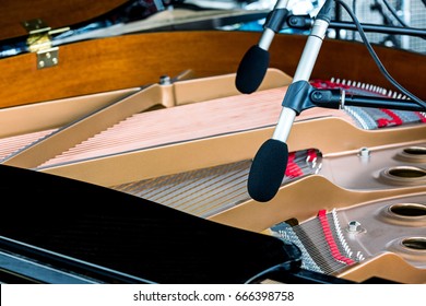 Microphones Above The Strings Of Black Grand Piano With Open Lid