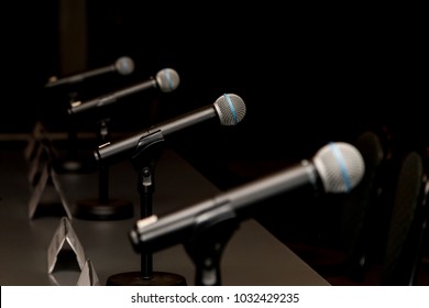 Microphones in press conference room, prepared for press conference. - Shutterstock ID 1032429235