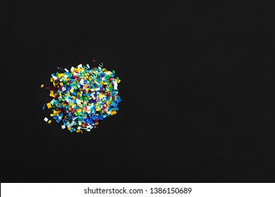 Microplastic On Black Background. Microplastic Problem. Threat To Human Health And The Environment. Dangerous Additives. Toxic Substances.